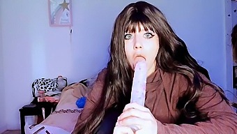 A Young Girl Dominates With A Massive Dildo In This Oral Sex Scene