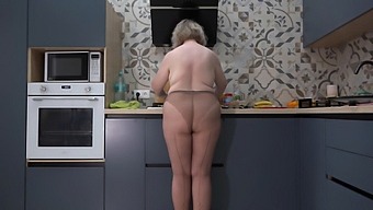 Watch A Busty Milf With A Big Ass In The Kitchen Behind The Scenes